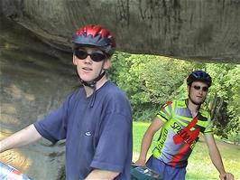 Olly and Tao inspect the underside of the dinosaur in Park im Grünen, Basel